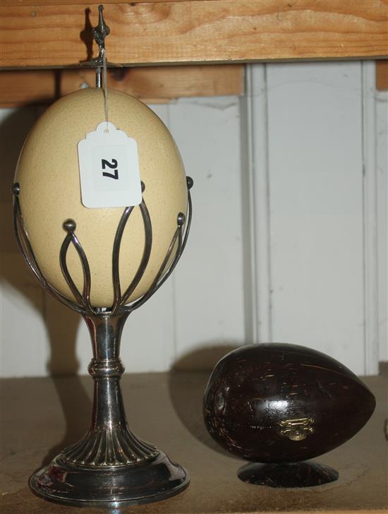 Mounted ostrich egg and another